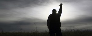 silhouette-man-hand-raised