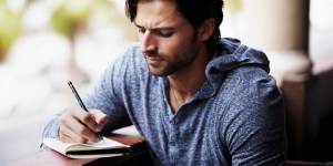 man journaling
